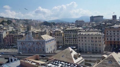 High angle view of buildings in city against sky