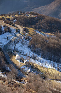 High angle view of snow covered mountain against sky