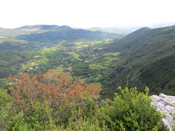 High angle view of trees and mountains against sky