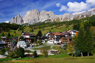 Houses and buildings against sky