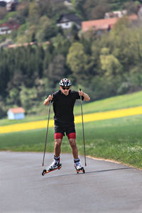 Full length of man roller skating at park