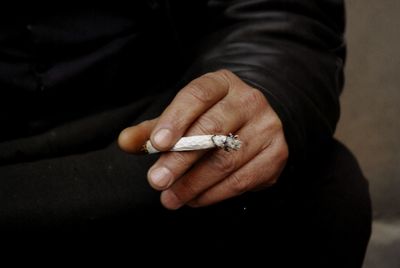 Close-up of man smoking cigarette