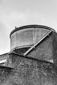 Low angle view of water tower against sky