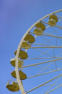 Ferris wheel in eger, hungary, minimal photo with blue sky