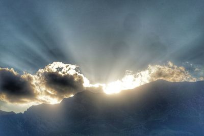 Low angle view of mountains against sky during sunset