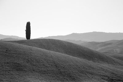 Scenic view of arid landscape against clear sky