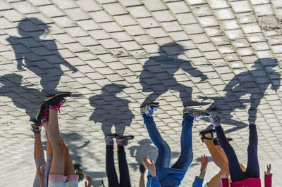 Upside down image of people on footpath in city