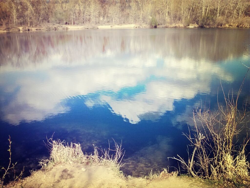 water, reflection, tranquility, tranquil scene, lake, scenics, beauty in nature, nature, idyllic, standing water, sky, tree, non-urban scene, forest, outdoors, no people, grass, day, non urban scene, calm