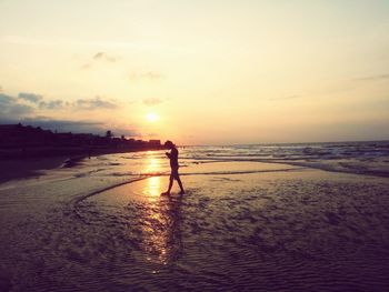 Scenic view of sea at sunset