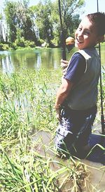 Woman standing by lake