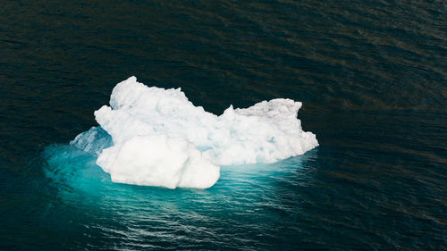 High angle view of ice floating on sea