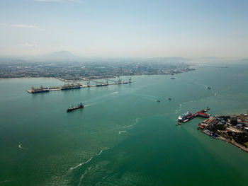 High angle view of boats in sea against sky