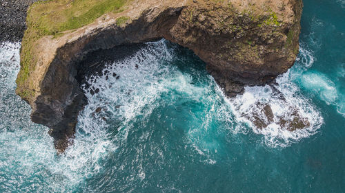 High angle view of rock formation in sea