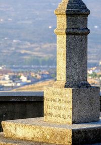 Close-up of stone structure in cemetery