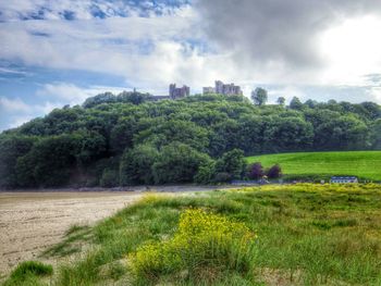 Scenic view of landscape against cloudy sky