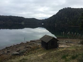 Scenic view of lake against cloudy sky