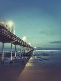 Pier on sea at dusk