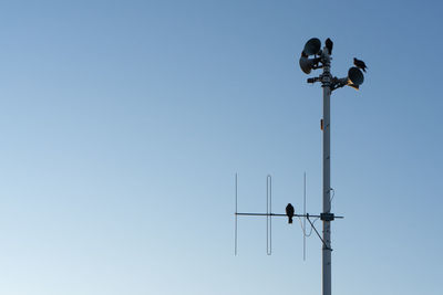 Low angle view of street light against clear sky