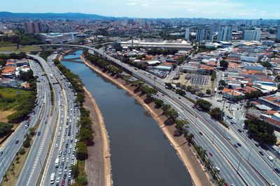 High angle view of road by buildings in city