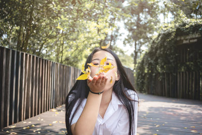 Portrait of young woman eating food