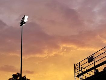 Low angle view of silhouette street light against sky during sunset