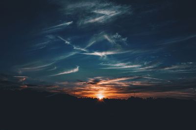 Low angle view of dramatic sky at sunset