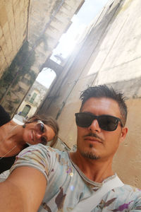 Portrait of young man wearing sunglasses outdoors