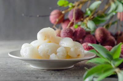 Close-up of fruits in plate on table