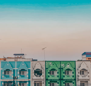 Buildings against sky at dusk