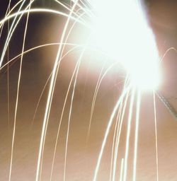 Low angle view of sunlight streaming through bright sun