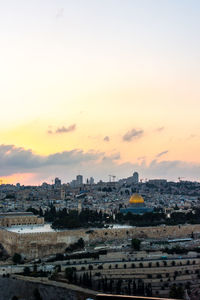 High angle view of buildings against sky during sunset