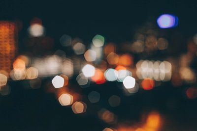 Defocused image of illuminated city street