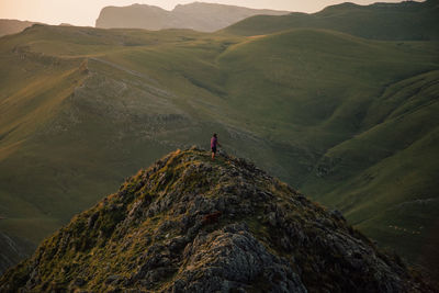 Man standing on mountain road