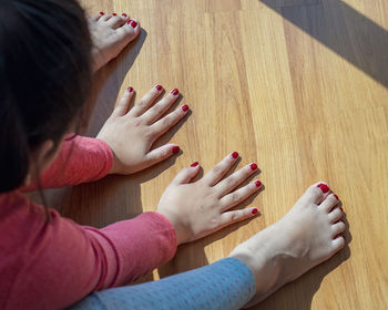 High angle view of woman sitting on floor