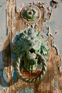Close-up of sculpture on door