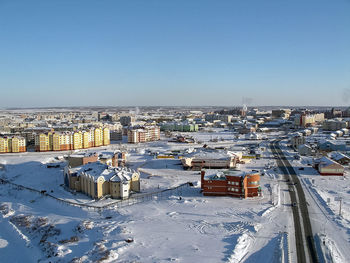 High angle view of townscape against clear blue sky