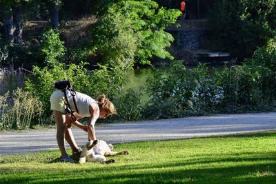 Rear view of woman with dog