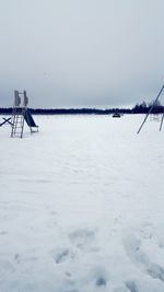 Scenic view of snow against sky during winter