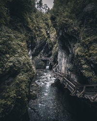 Scenic view of bridge amidst rock formation