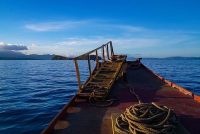 Pier at harbor against sky