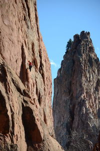 Low angle view of rock formations against sky