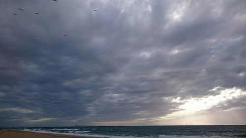 Scenic view of dramatic sky over sea