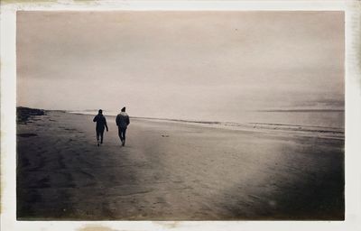 People walking on beach