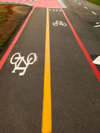 High angle view of arrow sign on road