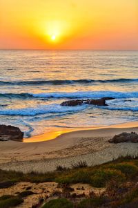 Scenic view of sea against sky during sunset
