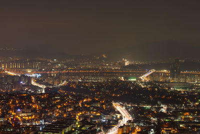 High angle view of illuminated city at night