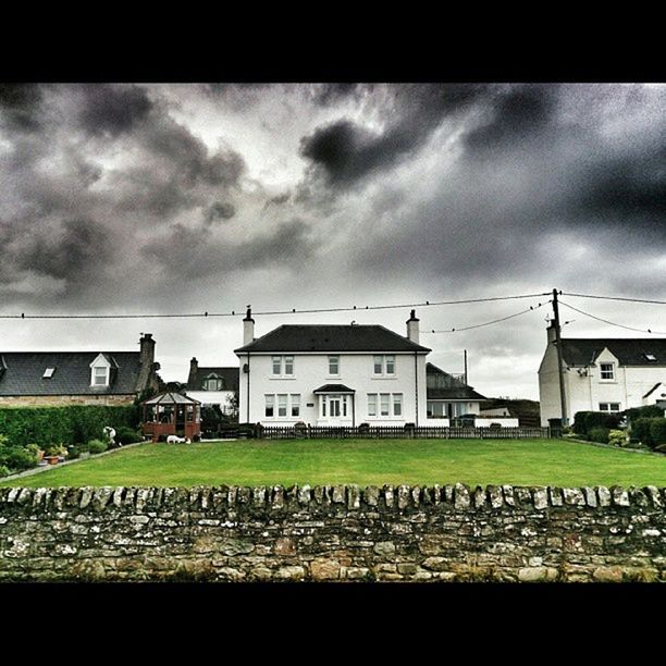 building exterior, sky, cloud - sky, cloudy, architecture, built structure, transfer print, house, cloud, auto post production filter, overcast, weather, storm cloud, residential structure, day, fence, transportation, outdoors, residential building, field