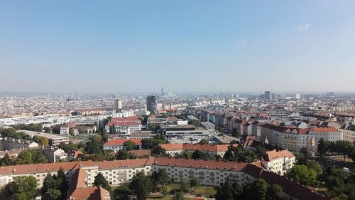 High angle view of buildings in city against clear sky