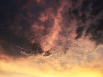 Low angle view of dramatic sky during sunset