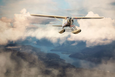 Low angle view of airplane flying in sky